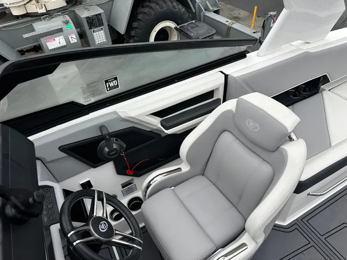  Yacht Photos Pics 2022 Cobalt R8 Surf boat interior with sleek steering and comfortable seating.