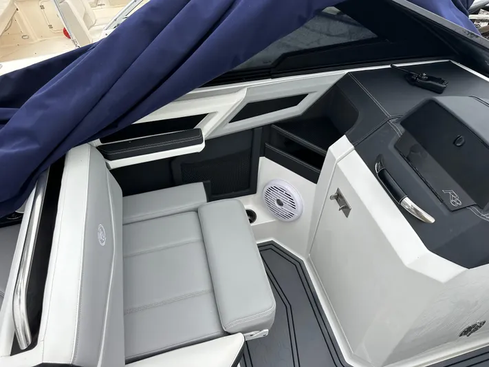  Yacht Photos Pics 2022 Cobalt R8 Surf boat interior with gray seating and modern design elements.