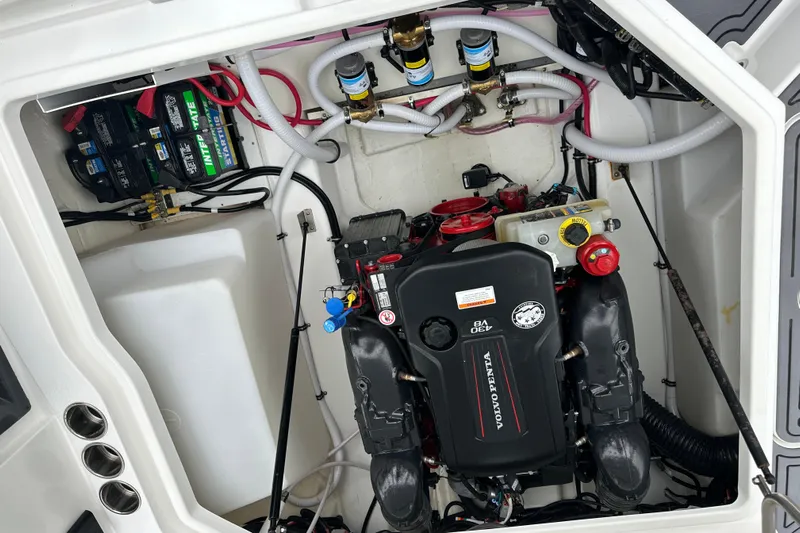  Yacht Photos Pics Engine compartment of a 2022 Cobalt R8 Surf boat, featuring Volvo Penta engine components.