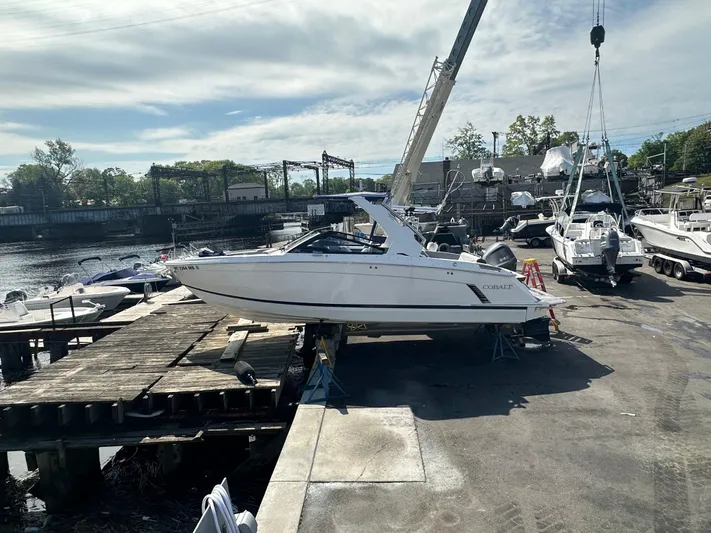  Yacht Photos Pics 2022 Cobalt R8 Surf boat on dock, ready for launch.