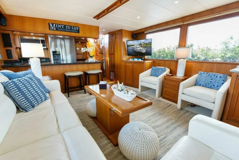 Orion II Yacht Photos Pics Luxurious interior of 2001 Grand Alaskan 64 Pilot House yacht with elegant seating and decor.