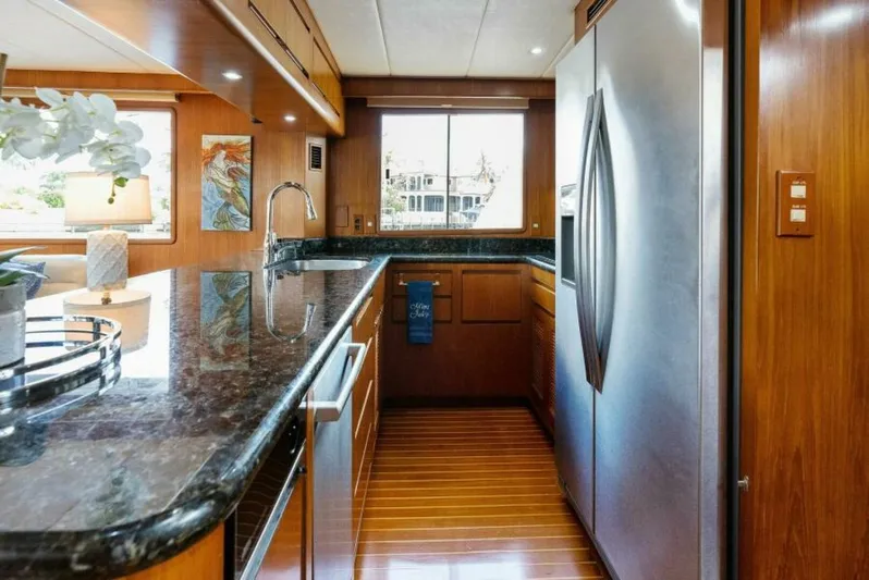 Orion II Yacht Photos Pics Luxurious kitchen interior of 2001 Grand Alaskan 64 Pilot House yacht with modern amenities.