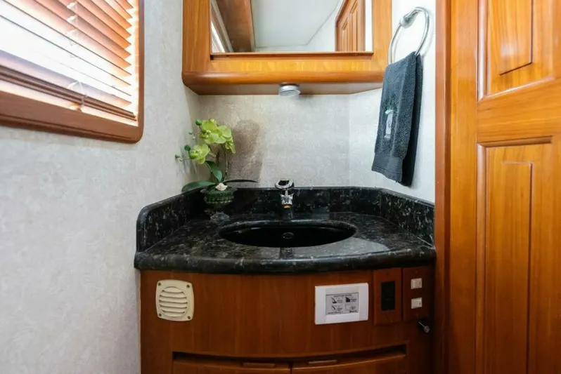Orion II Yacht Photos Pics Luxurious bathroom vanity in 2001 Grand Alaskan 64 Pilot House yacht.