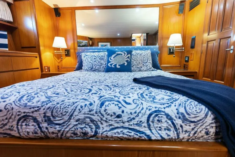 Orion II Yacht Photos Pics Luxurious bedroom in 2001 Grand Alaskan 64 pilot house yacht with nautical decor.