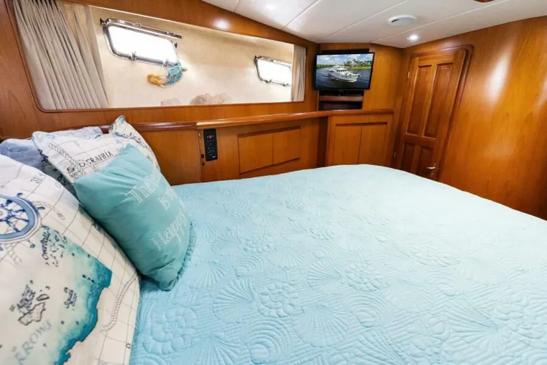 Orion II Yacht Photos Pics Luxurious cabin interior of 2001 Grand Alaskan 64 Pilot House yacht with cozy bedding.