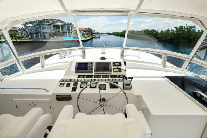 Orion II Yacht Photos Pics Grand Alaskan 64 Pilot House 2001 yacht helm with river view.