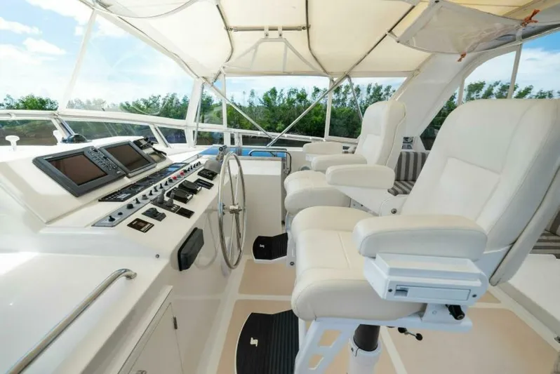 Orion II Yacht Photos Pics Grand Alaskan 64 Pilot House 2001 interior with helm, controls, and seating.