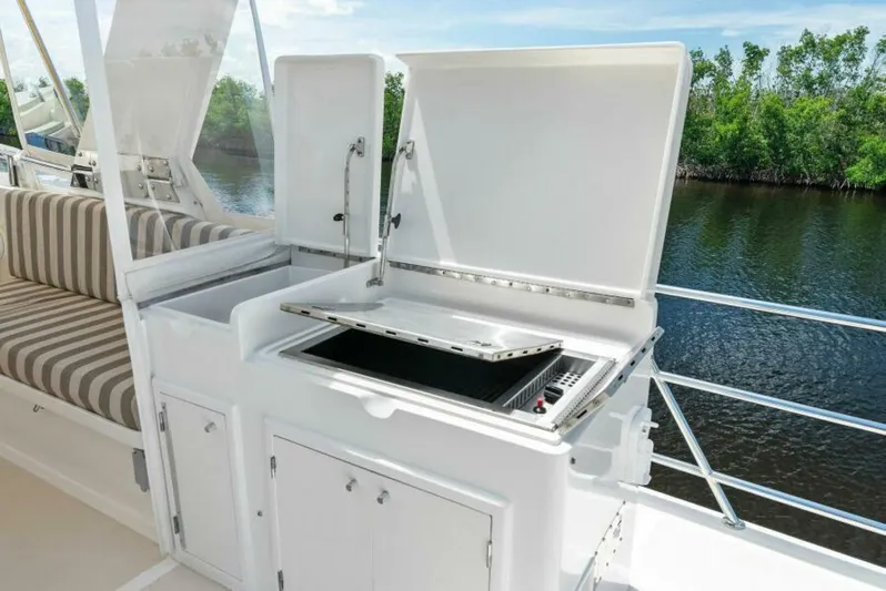 Orion II Yacht Photos Pics Outdoor kitchen on 2001 Grand Alaskan 64 pilot house yacht with grill and seating.