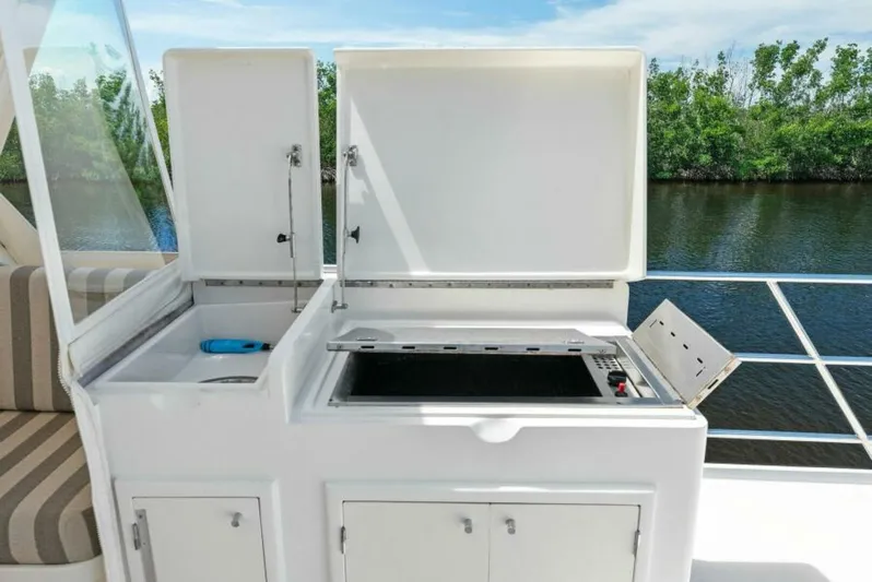 Orion II Yacht Photos Pics Outdoor kitchen on 2001 Grand Alaskan 64 Pilot House yacht, featuring grill and sink.