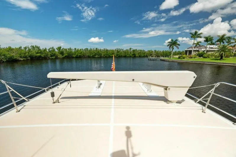 Orion II Yacht Photos Pics Grand Alaskan 64 Pilot House yacht deck with scenic waterfront view, 2001 model.