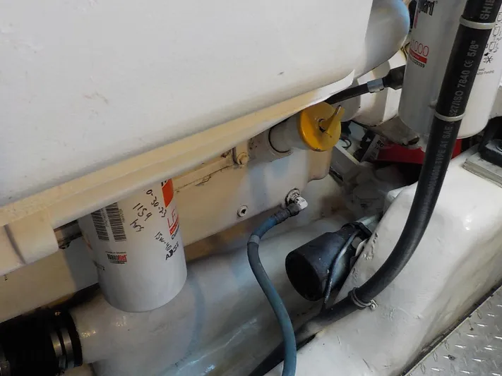 " Sarah Jane " Yacht Photos Pics Engine room of 2006 Tiara Yachts 4400 Sovran with filters and hoses.