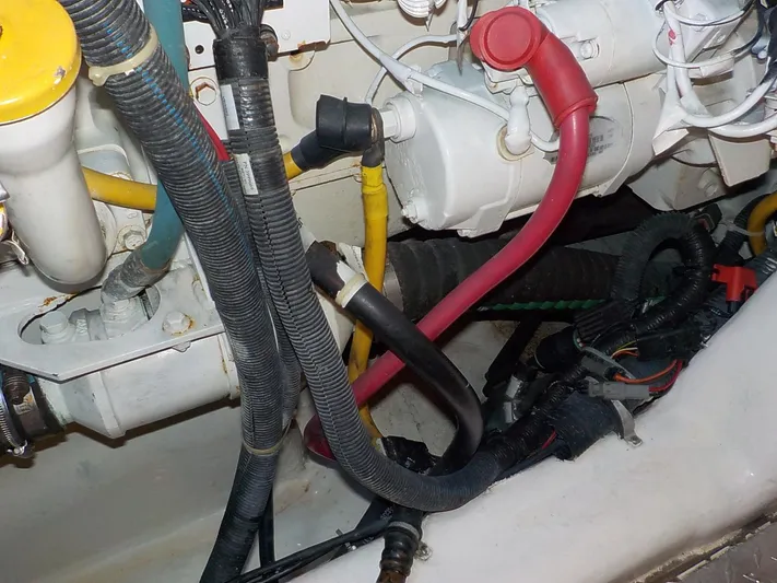 " Sarah Jane " Yacht Photos Pics Engine compartment of 2006 Tiara Yachts 4400 Sovran with cables and hoses.