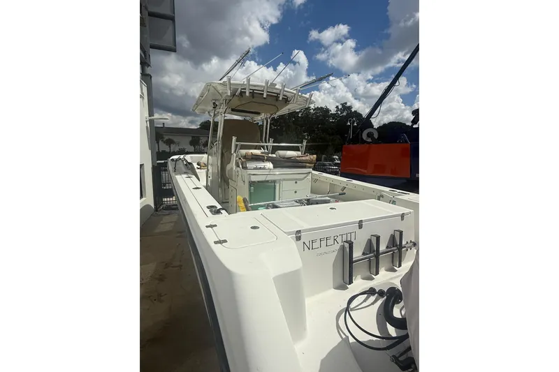  Yacht Photos Pics 2010 Edgewater 318CC boat docked under cloudy sky.