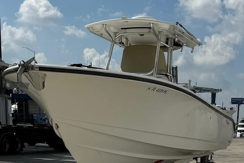  Yacht Photos Pics 2010 Edgewater 318CC boat docked under a cloudy sky.