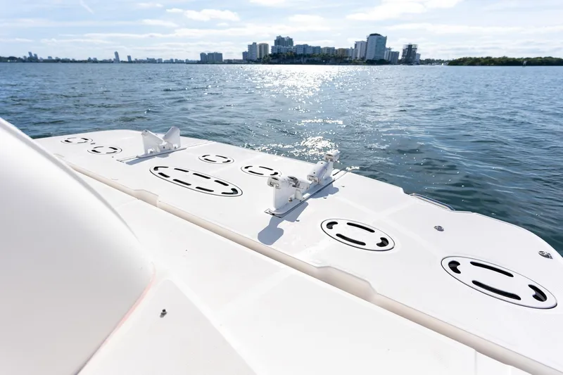 Yacht Photos Pics 2005 Sea Ray 48 Sundancer boat deck with city skyline in background.