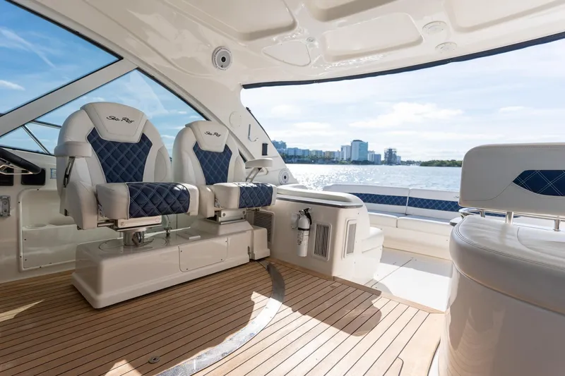  Yacht Photos Pics Luxurious 2005 Sea Ray 48 Sundancer yacht interior with elegant seating and scenic water view.