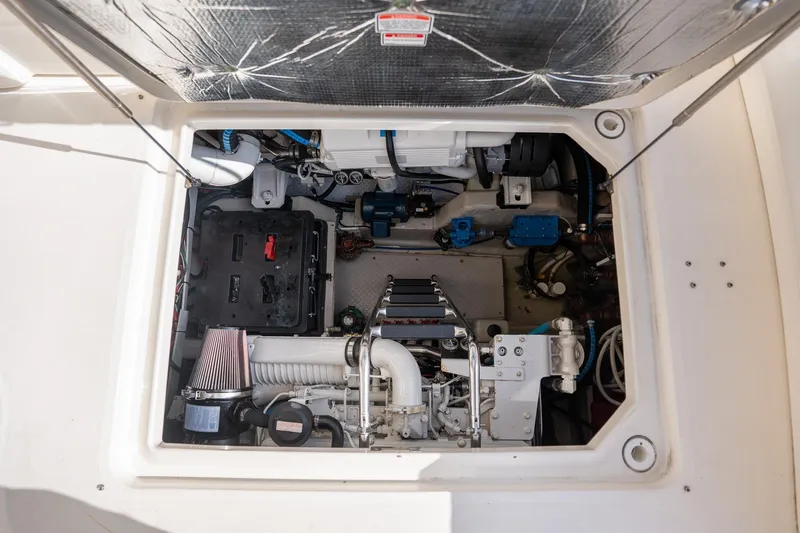  Yacht Photos Pics Engine compartment of a 2005 Sea Ray 48 Sundancer yacht, showcasing mechanical components.