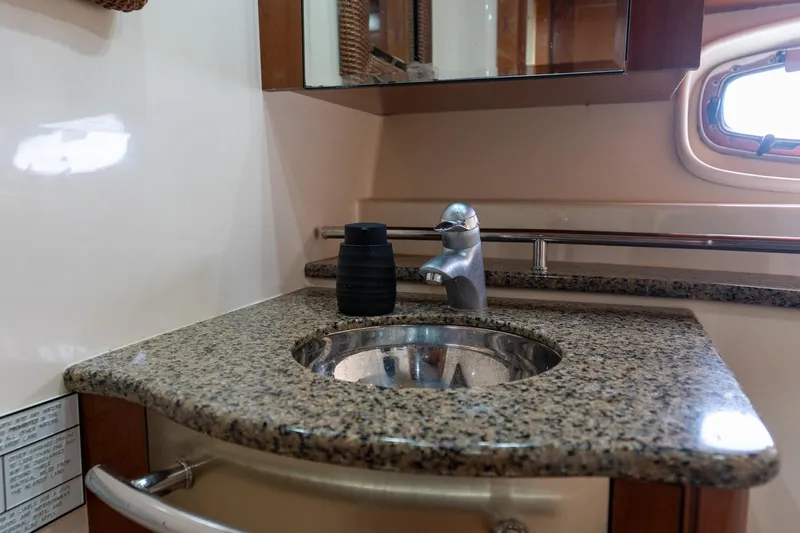  Yacht Photos Pics Luxurious bathroom sink with granite countertop on 2005 Sea Ray 48 Sundancer yacht.