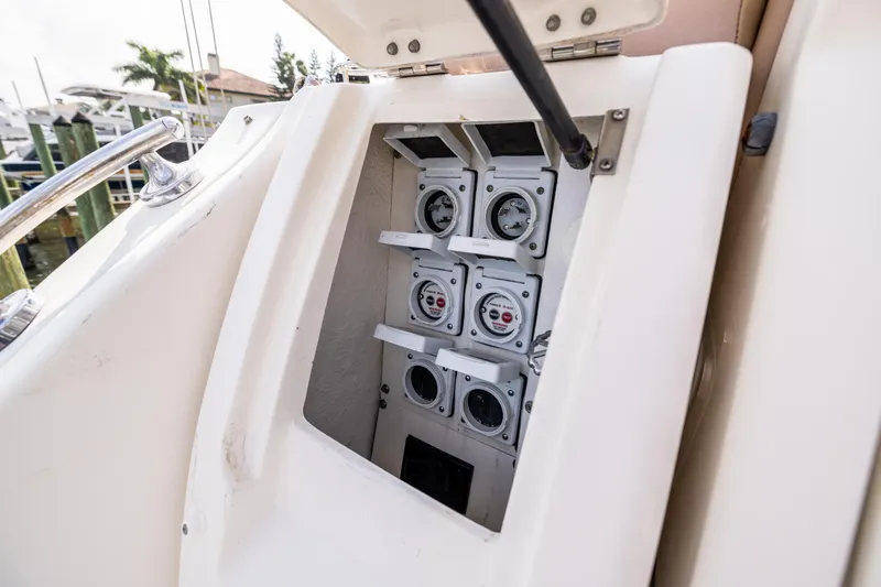  Yacht Photos Pics Electrical panel on a 2016 Sea Ray 310 Sundancer boat, showcasing gauges and controls.