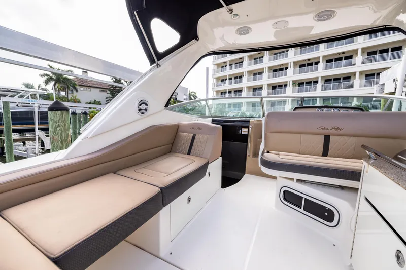  Yacht Photos Pics 2016 Sea Ray 310 Sundancer interior with beige seating and modern design.