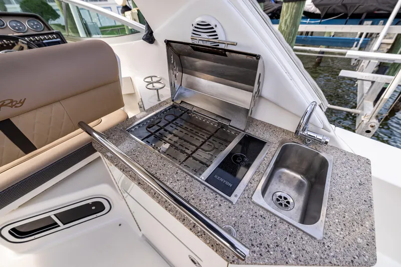  Yacht Photos Pics Outdoor kitchen on 2016 Sea Ray 310 Sundancer with grill and sink.