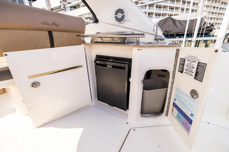  Yacht Photos Pics 2016 Sea Ray 310 Sundancer boat interior with kitchenette and storage compartments.