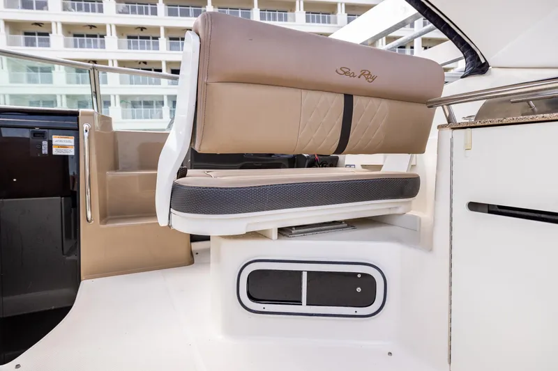  Yacht Photos Pics 2016 Sea Ray 310 Sundancer interior seating with beige upholstery and modern design.