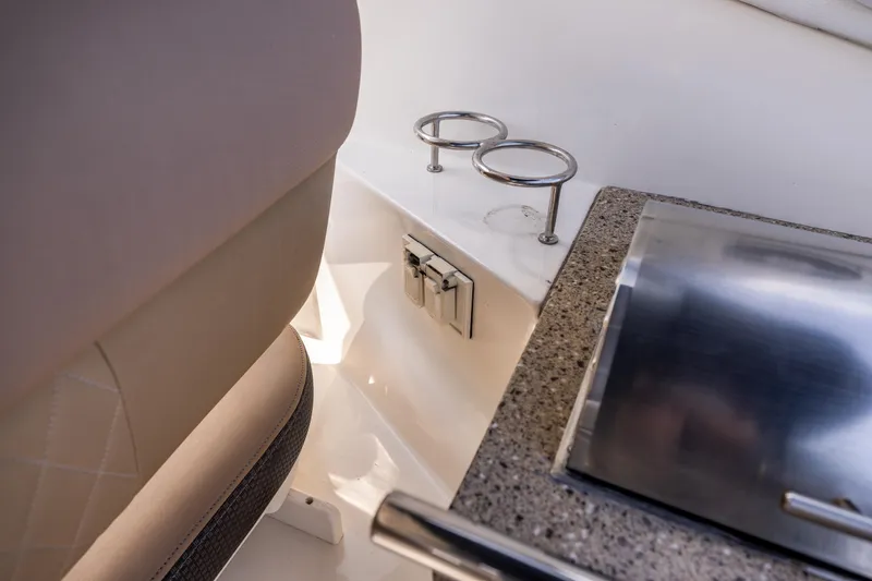  Yacht Photos Pics Interior of 2016 Sea Ray 310 Sundancer with cup holders and countertop.