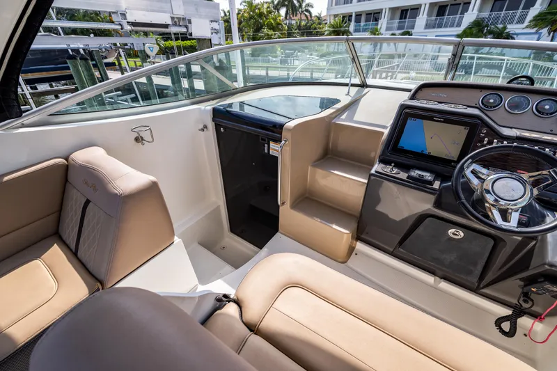  Yacht Photos Pics 2016 Sea Ray 310 Sundancer cockpit with modern navigation system and comfortable seating.