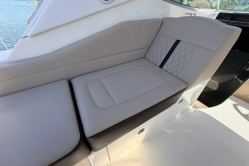  Yacht Photos Pics Luxurious seating on 2016 Sea Ray Sundancer 310 boat, featuring elegant upholstery design.