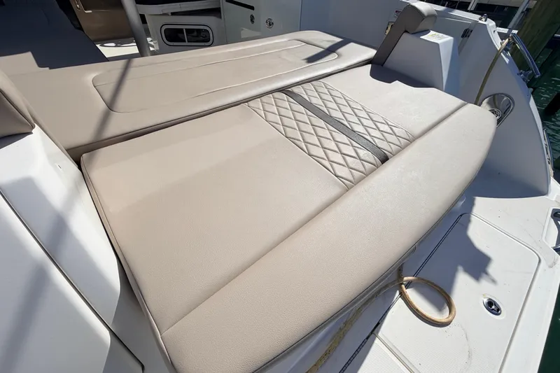  Yacht Photos Pics Luxurious seating on 2016 Sea Ray Sundancer 310 boat, featuring elegant diamond-pattern upholstery.