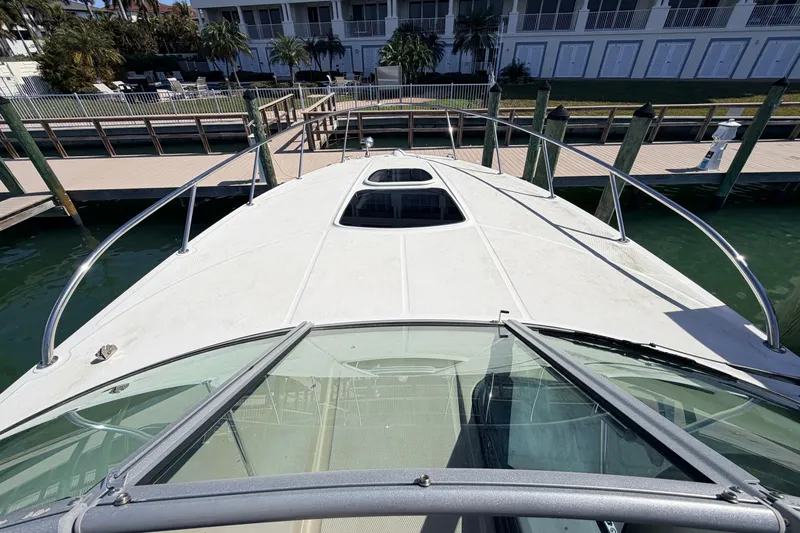  Yacht Photos Pics 2016 Sea Ray Sundancer 310 yacht docked at marina, view from bow.