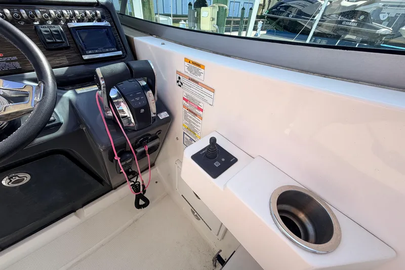  Yacht Photos Pics 2016 Sea Ray Sundancer 310 helm with controls, joystick, and cup holder.