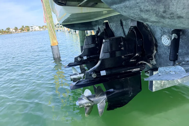  Yacht Photos Pics 2016 Sea Ray Sundancer 310 boat propellers in clear water at a dock.