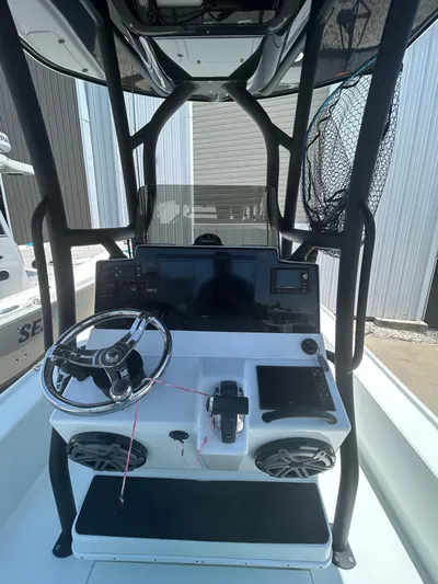  Yacht Photos Pics 2021 Yellowfin 24 Bay CE boat console with steering wheel and electronics.