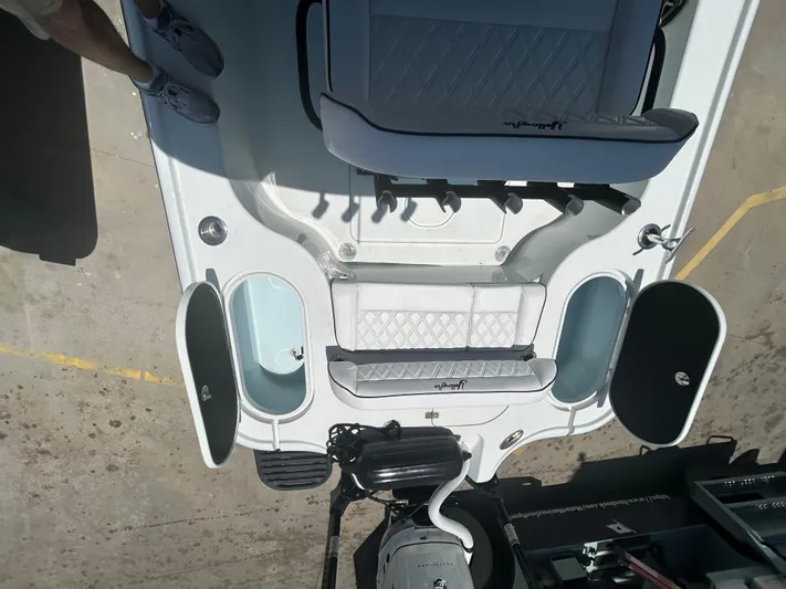  Yacht Photos Pics 2021 Yellowfin 24 Bay CE boat interior with seating and storage compartments.