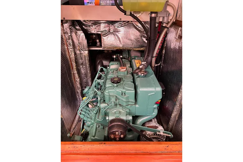 Animal Spirits Yacht Photos Pics Engine compartment of a 2014 Hanse 445 sailboat, featuring a green marine engine.