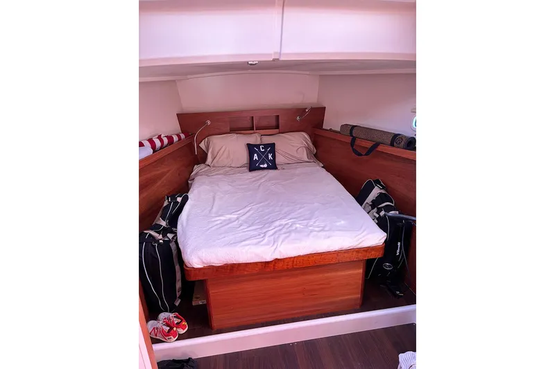 Animal Spirits Yacht Photos Pics Cozy cabin interior of 2014 Hanse 445 yacht with a neatly made bed.
