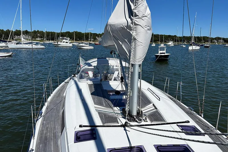 Animal Spirits Yacht Photos Pics Sailing yacht Hanse 445, 2014 model, docked in a serene marina with clear blue skies.