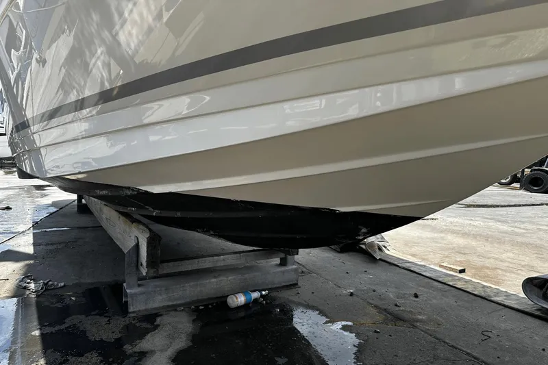 Parce Yacht Photos Pics 2016 Sea Ray 310 Sundancer boat hull on dry dock for maintenance.