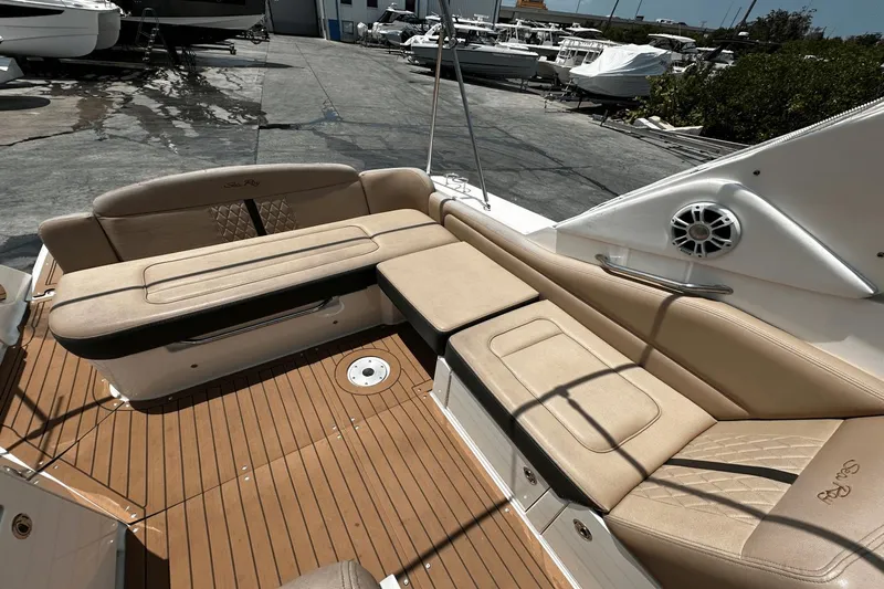 Parce Yacht Photos Pics 2016 Sea Ray 310 Sundancer boat interior with beige seating and teak flooring.