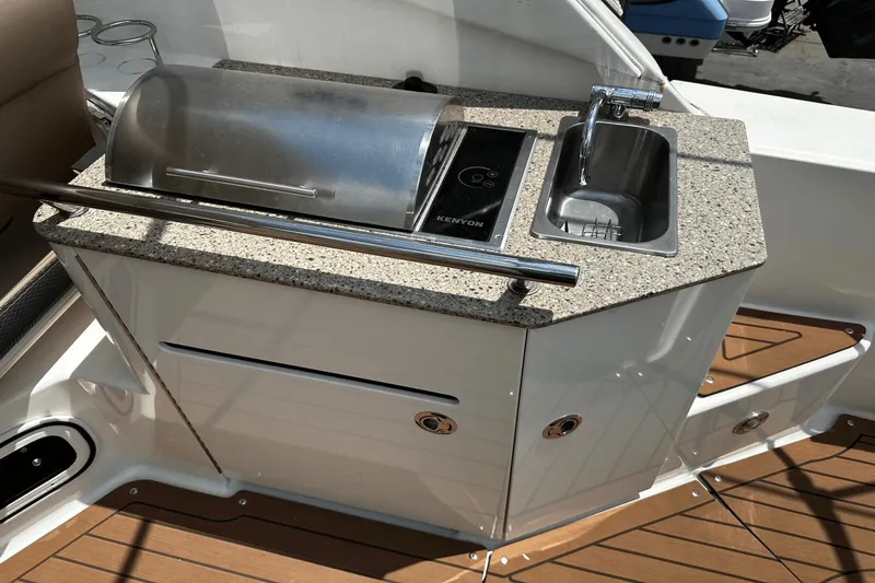 Parce Yacht Photos Pics Outdoor kitchenette on 2016 Sea Ray 310 Sundancer with grill and sink.