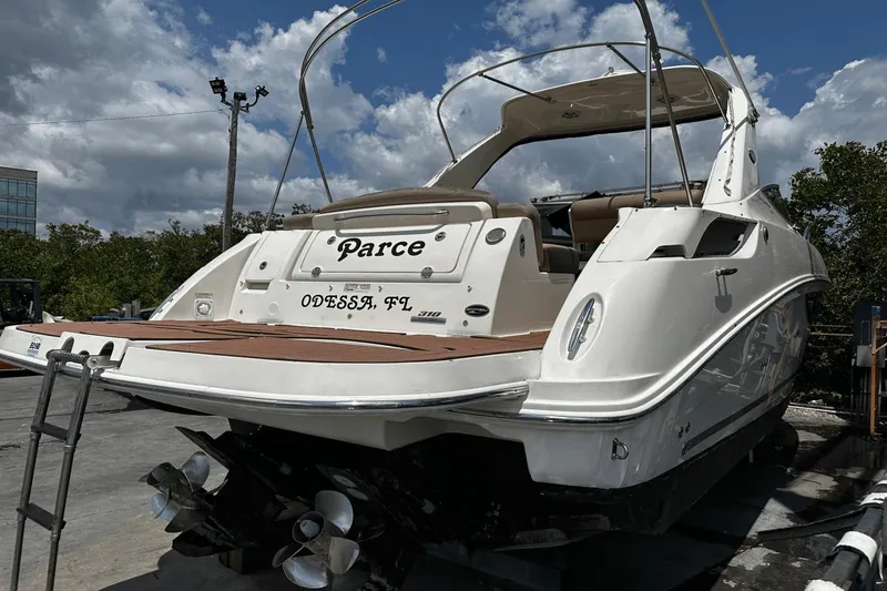 Parce Yacht Photos Pics 2016 Sea Ray 310 Sundancer boat docked, rear view, with "Parce" and "Odessa, FL" on stern.