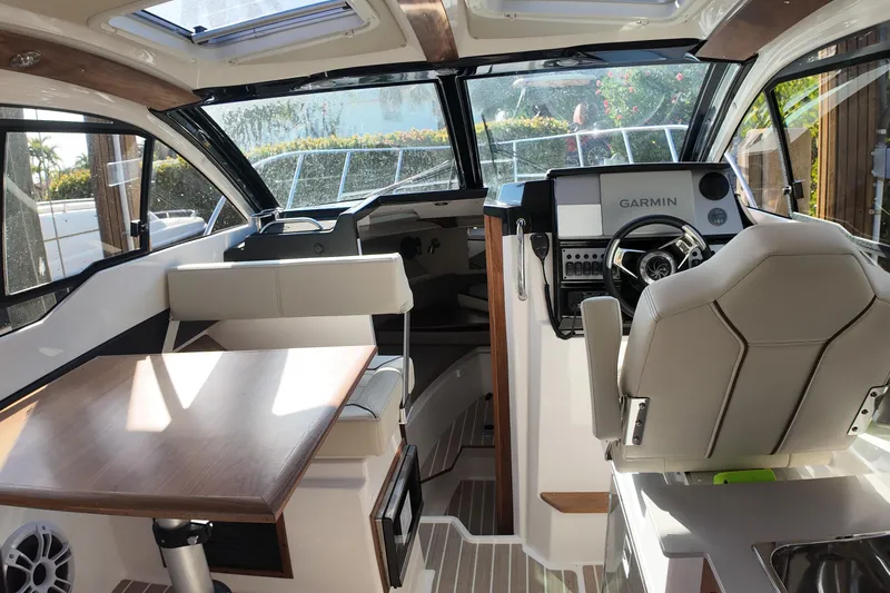  Yacht Photos Pics Interior of 2026 Solara S-250 Coupe boat with modern helm and seating area.