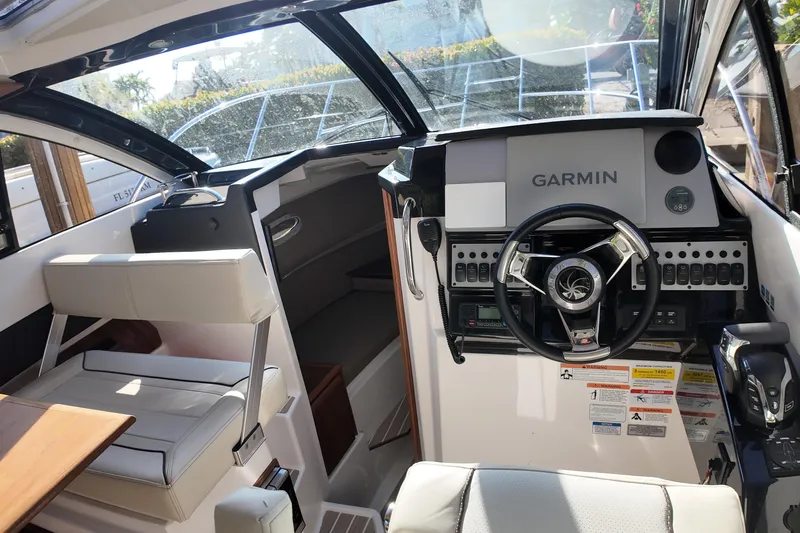  Yacht Photos Pics Interior of 2026 Solara S-250 Coupe boat with Garmin navigation system.