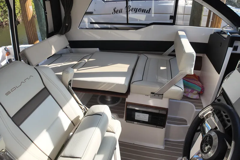  Yacht Photos Pics Interior of 2026 Solara S-250 Coupe boat with luxurious seating and modern design.