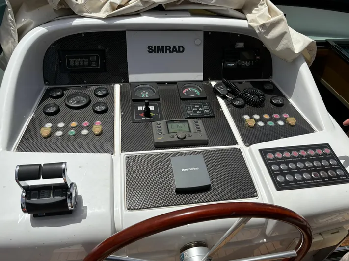  Yacht Photos Pics Control panel of a 2006 Maiora 20S yacht with Simrad navigation system.