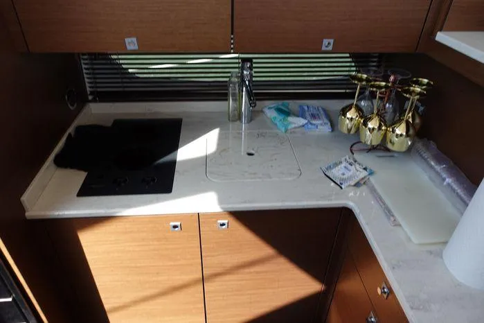  Yacht Photos Pics 2012 Sea Ray 450 Sedan Bridge kitchen with stove, sink, and countertop accessories.