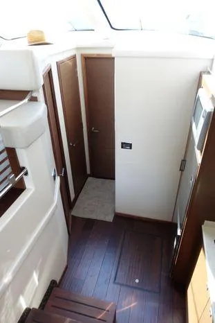  Yacht Photos Pics Interior of 2012 Sea Ray 450 Sedan Bridge with wood flooring and modern design.