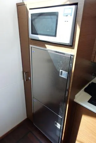  Yacht Photos Pics 2012 Sea Ray 450 Sedan Bridge kitchen with microwave and stainless steel fridge.